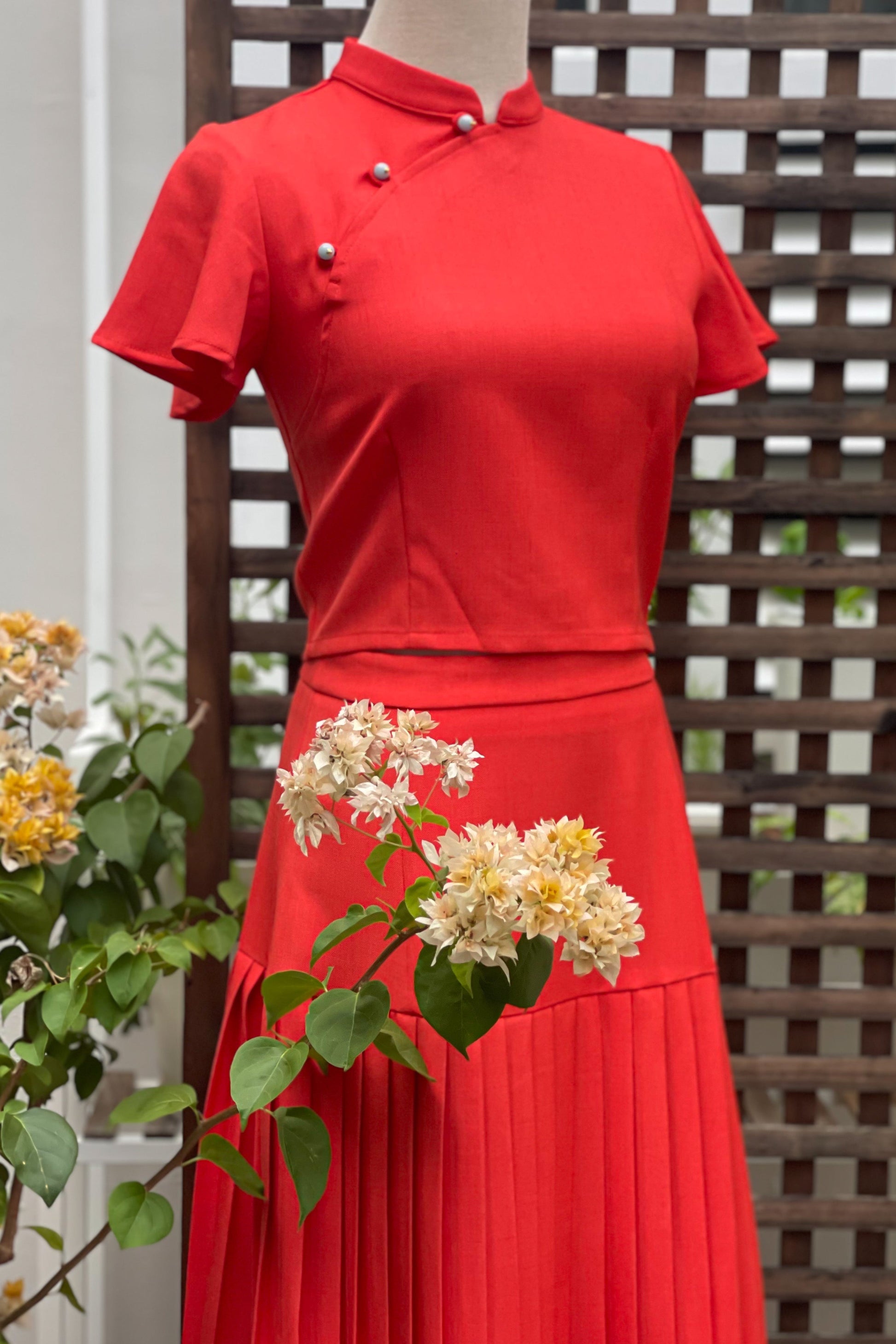 PLISSER SKIRT IN TANGERINE